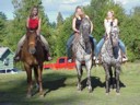 photo of neighbor girls riding my horses